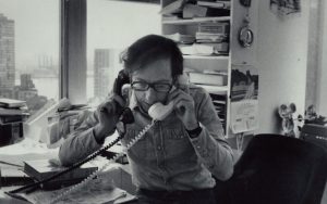 Radio Jai -Robert Gottlieb holding two phones in an undated photo. (Thomas Victor/ Courtesy of the Estate of Thomas Victor, LLC / Sony Pictures Classics)